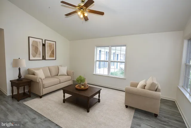 a workspace with wooden floor and a window