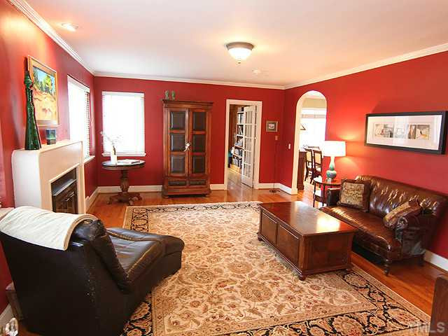 3015 Ruffin Street Raleigh, NC 27607 - Photo 5 of 25 Look at the architectural details in this room! Arched entryway, hardwoods, crown molding, and a fireplace. Enjoy a cozy evening with your friends and family right here. Other
