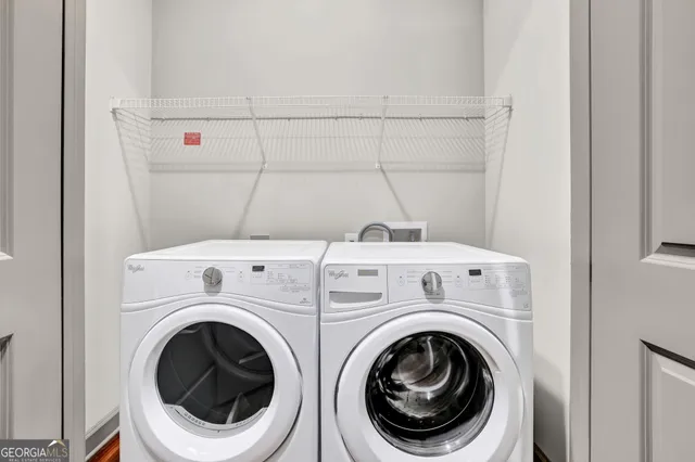 a utility room with dryer and washer