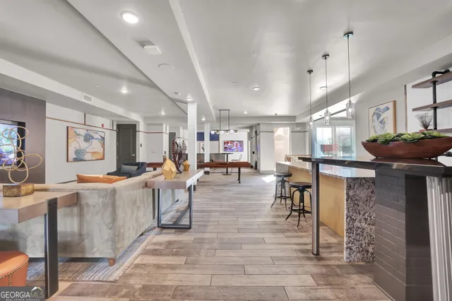 a living room with lots of furniture and a table