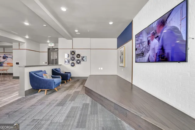 a living room with furniture and a rug