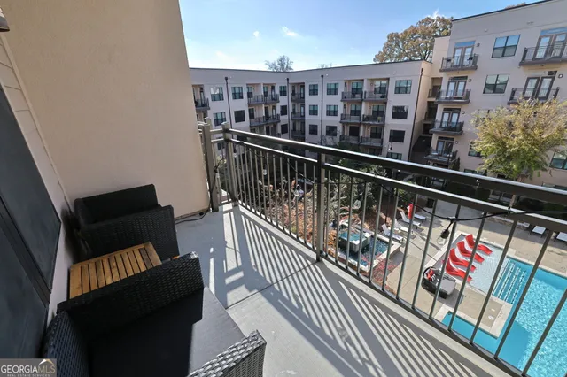 a view of balcony with wooden floor