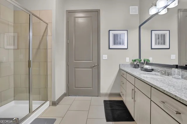 a kitchen with a sink and a mirror