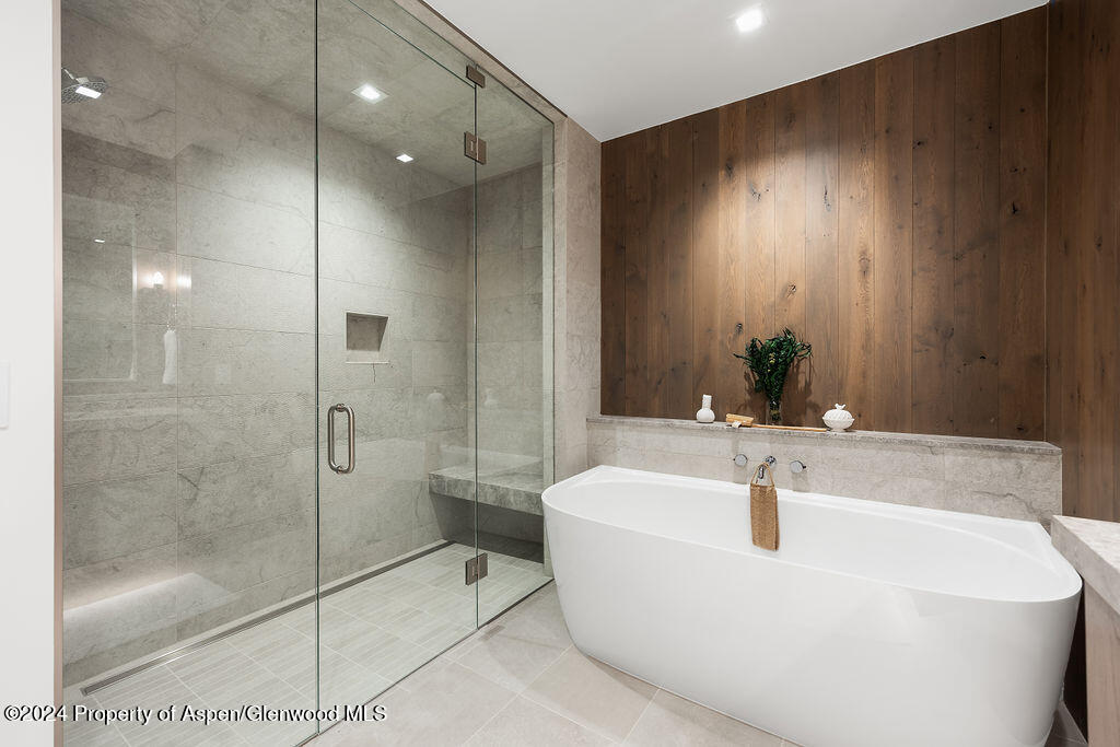 180 Wood Road, Unit 302 Snowmass Village, CO 81615 - Photo 17 of 43 a bathroom with a bathtub and shower