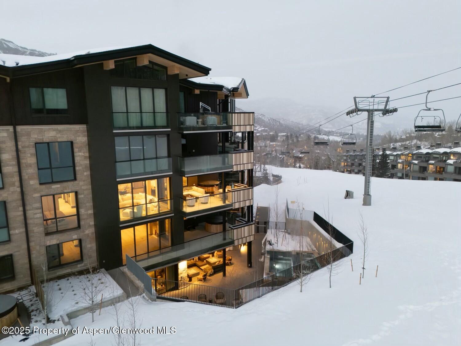 180 Wood Road, Unit 302 Snowmass Village, CO 81615 - Photo 31 of 43 a view of a living room and kitchen