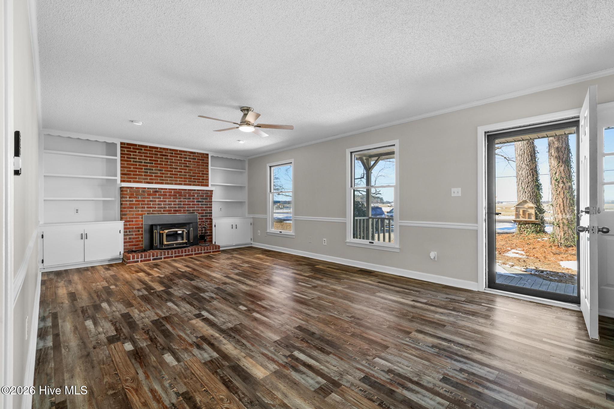 1039 Consolidated Road Elizabeth City, NC 27909 - Photo 5 of 49 Great w/fireplace wood burning insert with wood box.