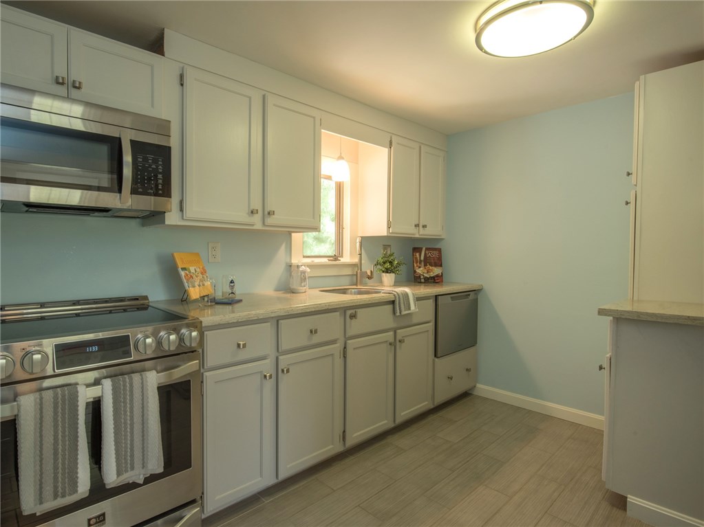 119 West Beach Road Charlestown, RI 02813 - Photo 11 of 40 UPDATED KITCHEN WITH STAINLESS STEEL APPLIANCES AND PLENTY OF CABINET STORAGE.