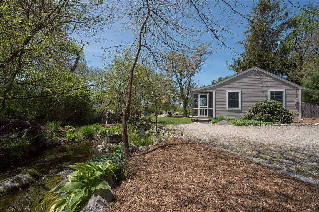119 West Beach Road Charlestown, RI 02813 - Photo 3 of 40 VIEW OF TRANQUIL BROOK AND STONE DRIVEWAY LEADING INTO YOUR PRIVATE OASIS.