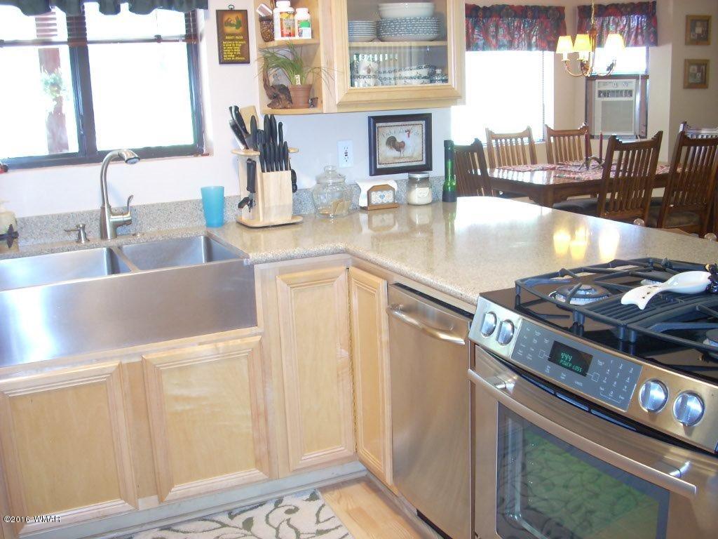 2101 Chevelon Road Overgaard, AZ 85933 - Photo 11 of 45 a kitchen with a stove and a sink
