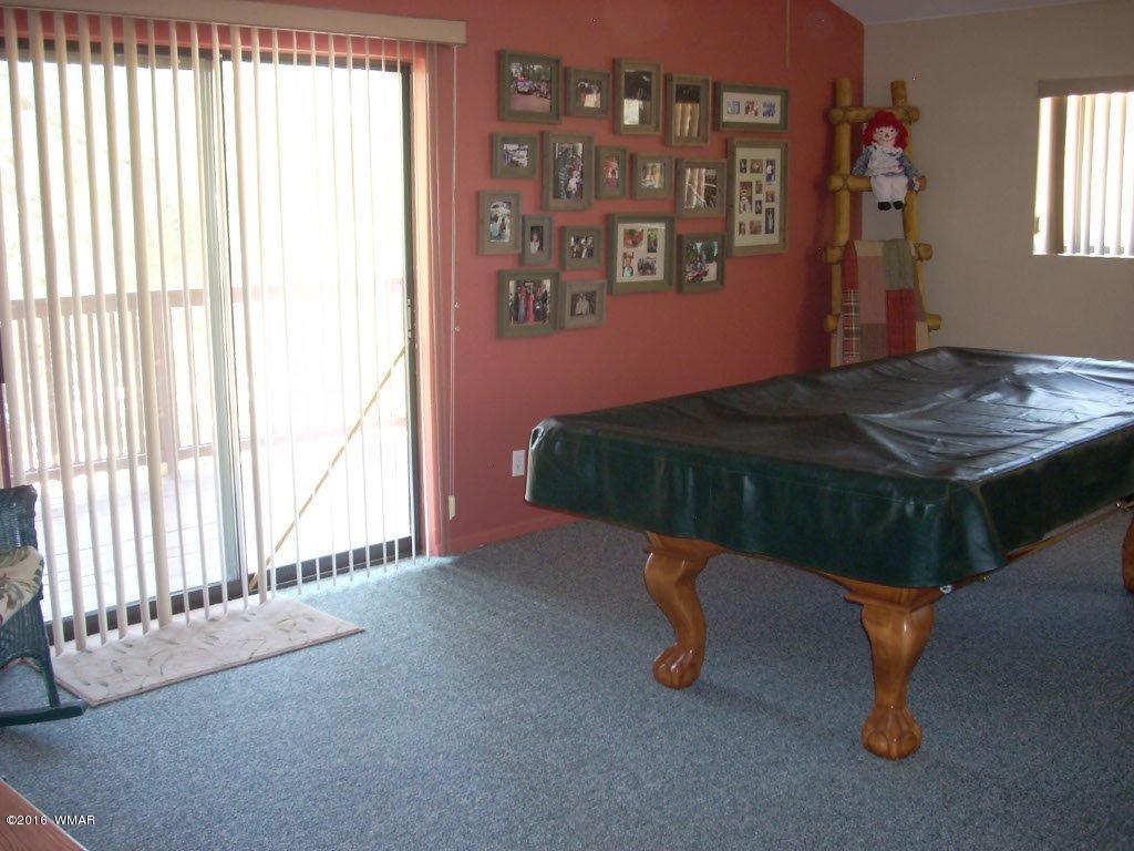 2101 Chevelon Road Overgaard, AZ 85933 - Photo 12 of 45 a room with a table and windows
