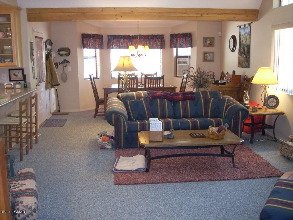 2101 Chevelon Road Overgaard, AZ 85933 - Photo 40 of 45 a living room with furniture and a large window