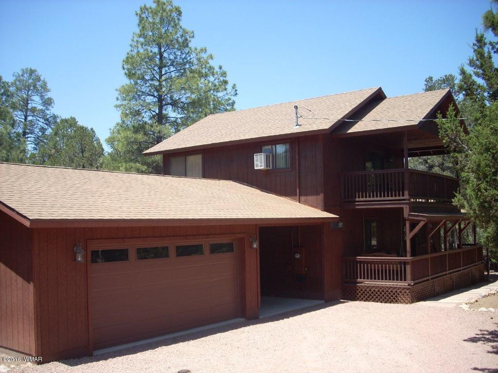 2101 Chevelon Road Overgaard, AZ 85933 - Photo 4 of 45 a front view of house with parking space