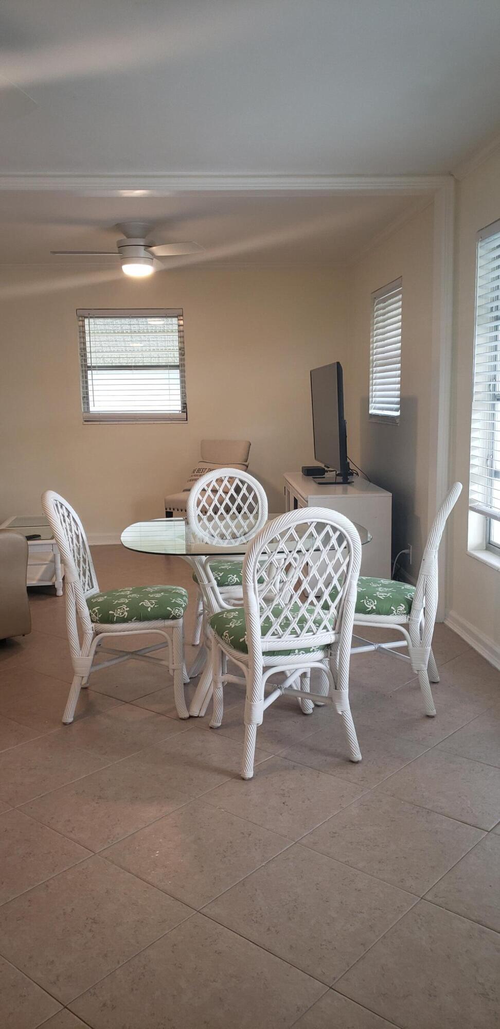 4107 Southeast Barcelona Street Stuart, FL 34997 - Photo 11 of 19 a bedroom with furniture and a window