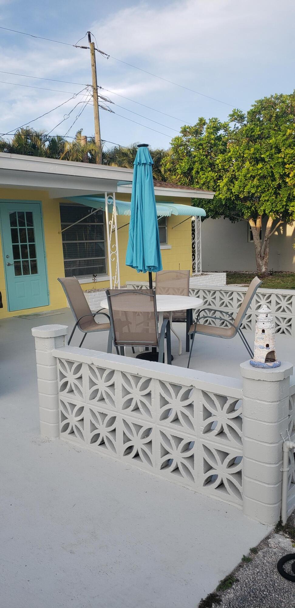 4107 Southeast Barcelona Street Stuart, FL 34997 - Photo 15 of 19 a front view of a house with patio