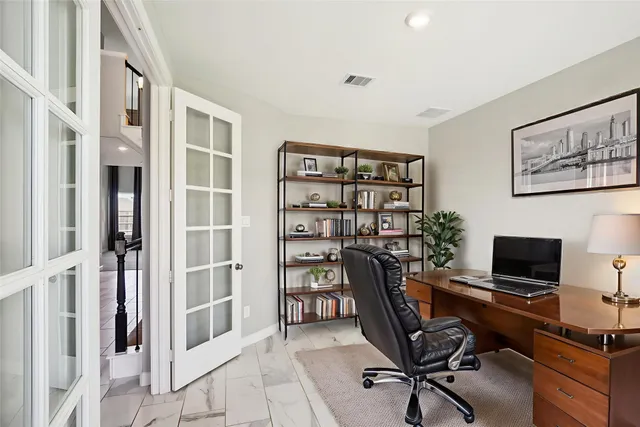 a view of a workspace with furniture