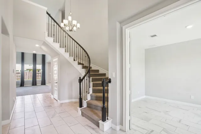 a view of entryway and hall with a living room