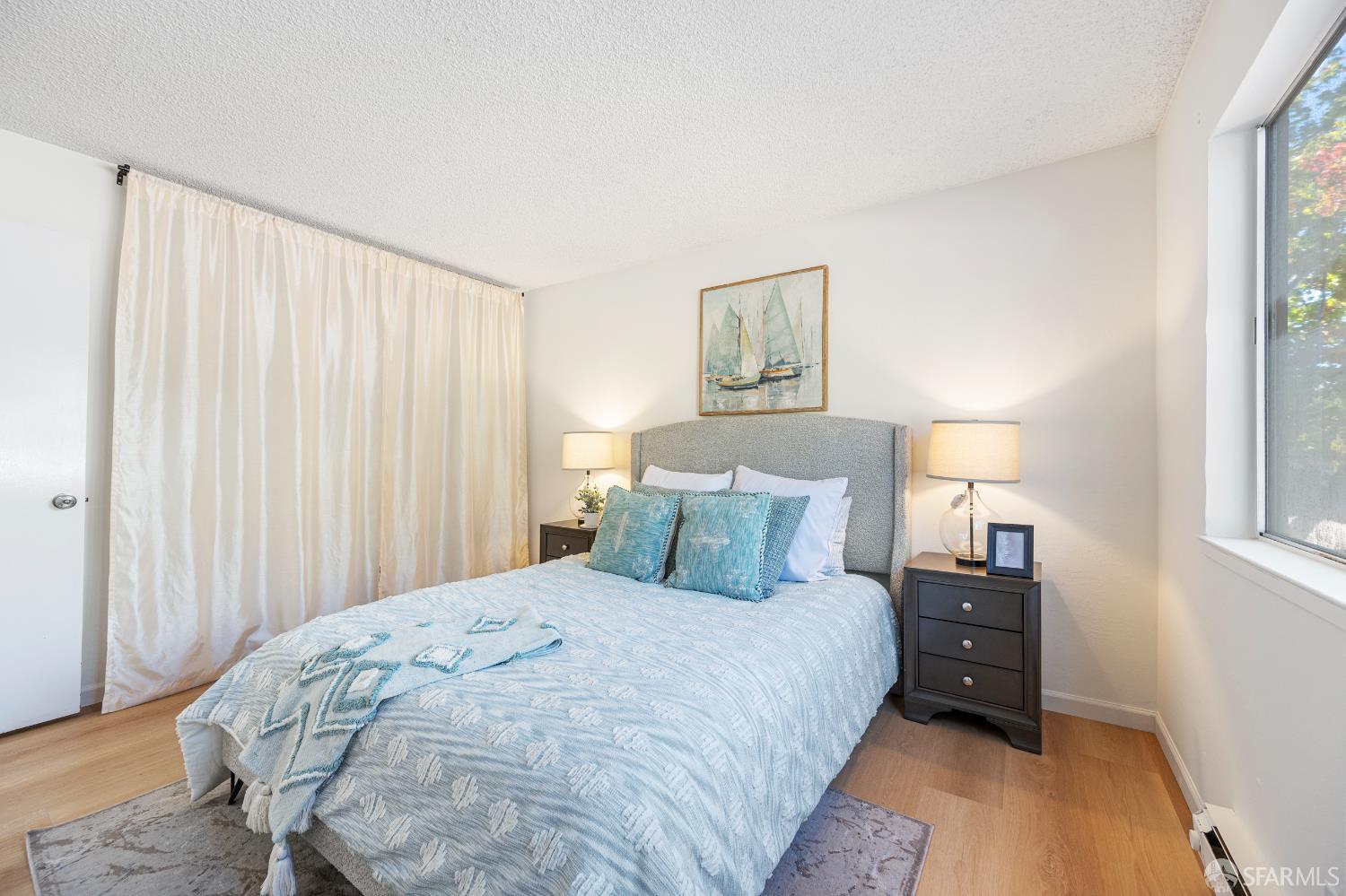 1327 Webster Street, Unit B210 Alameda, CA 94501 - Photo 22 of 55 a bedroom with a bed and a window