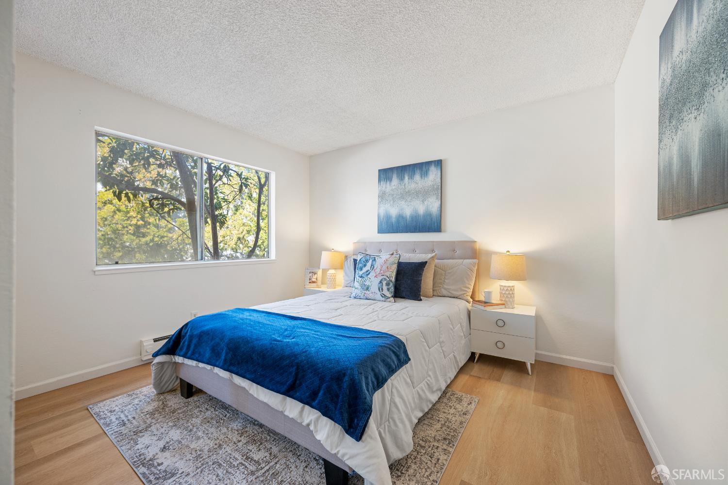 1327 Webster Street, Unit B210 Alameda, CA 94501 - Photo 24 of 55 a bedroom with a bed and a window
