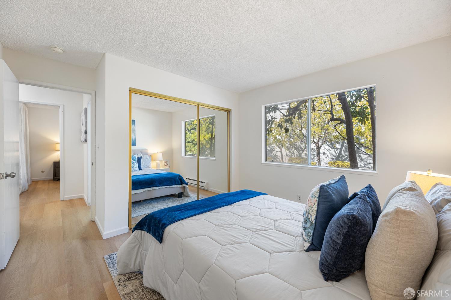 1327 Webster Street, Unit B210 Alameda, CA 94501 - Photo 26 of 55 a bedroom with a bed and a window