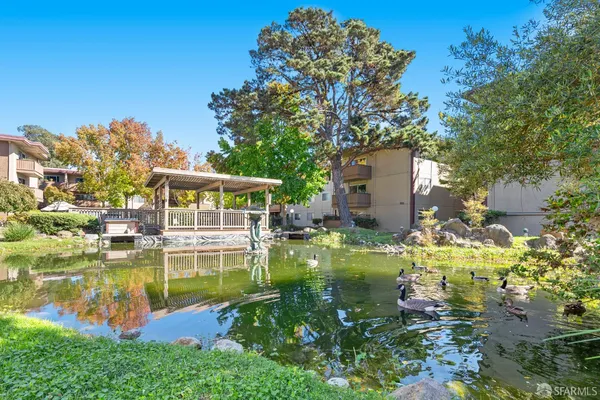 a front view of a building with outdoor seating