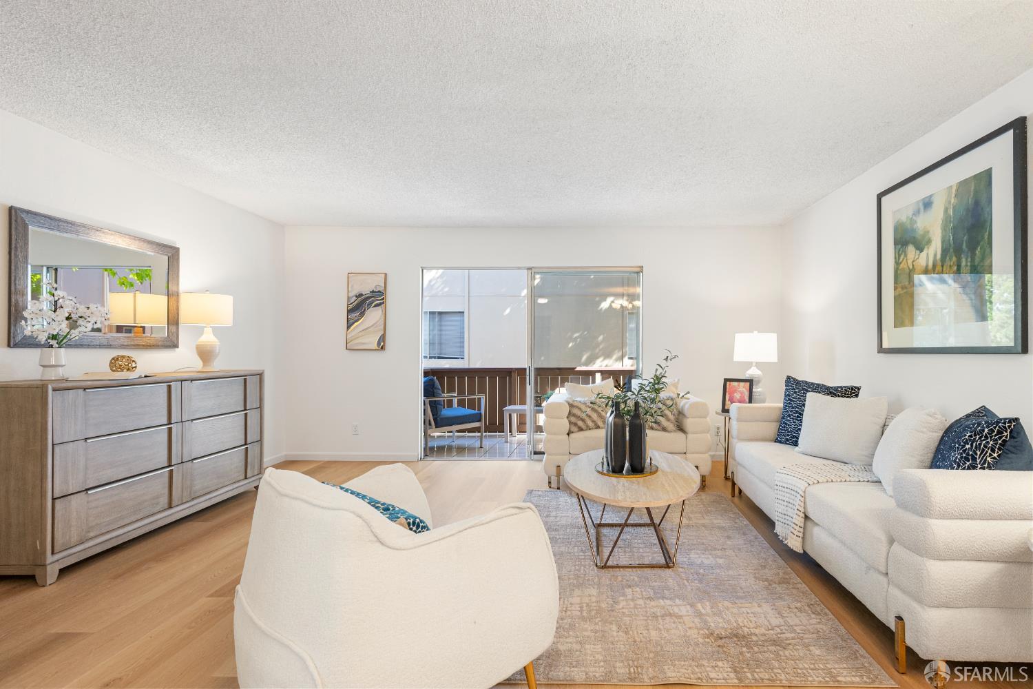 1327 Webster Street, Unit B210 Alameda, CA 94501 - Photo 4 of 55 a living room with furniture a rug and white walls