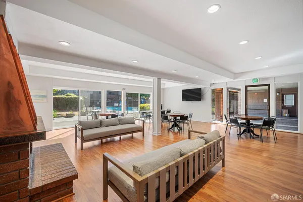 a large white kitchen with stainless steel appliances