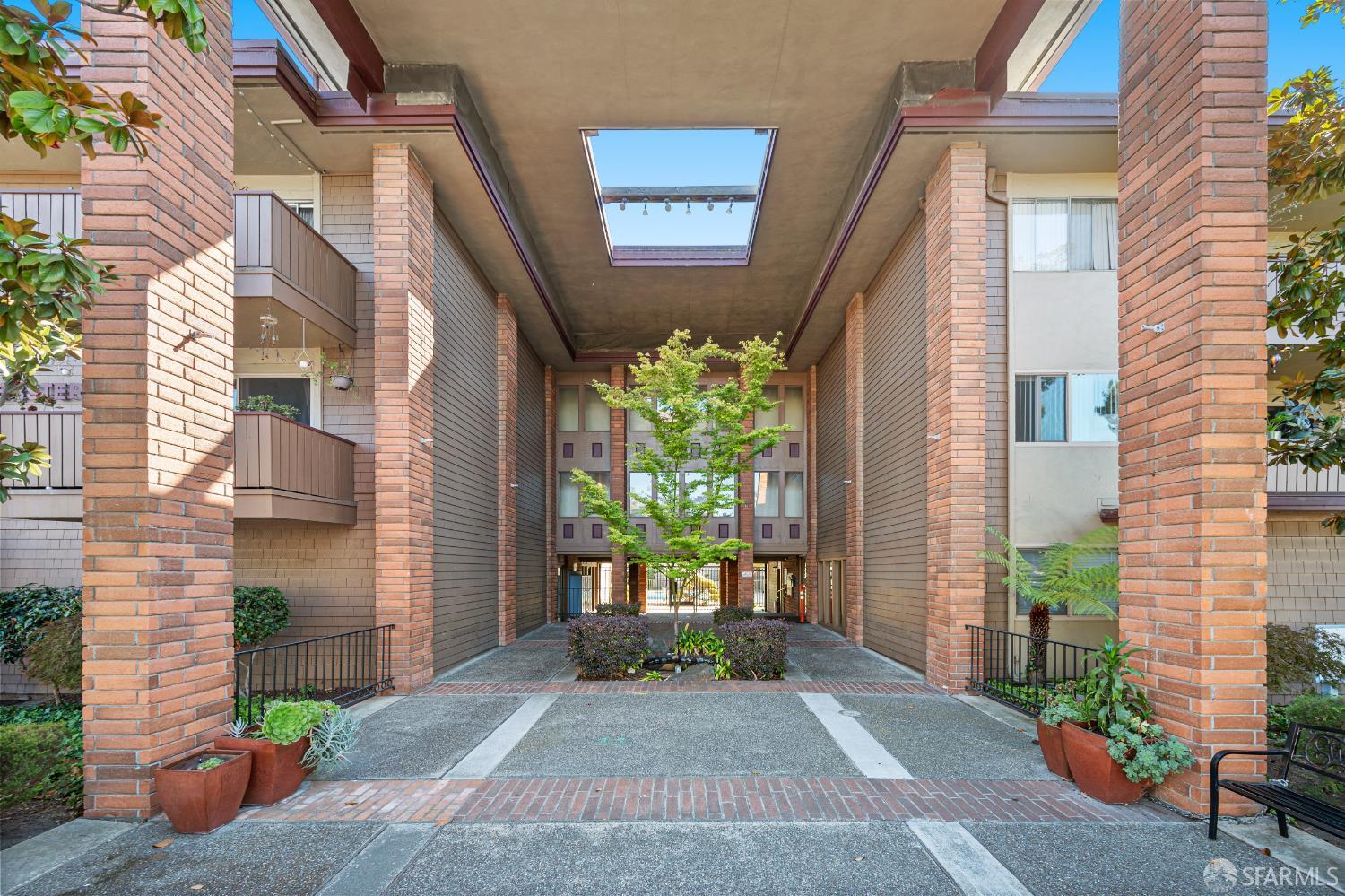 1327 Webster Street, Unit B210 Alameda, CA 94501 - Photo 47 of 55 a view of a house with a yard