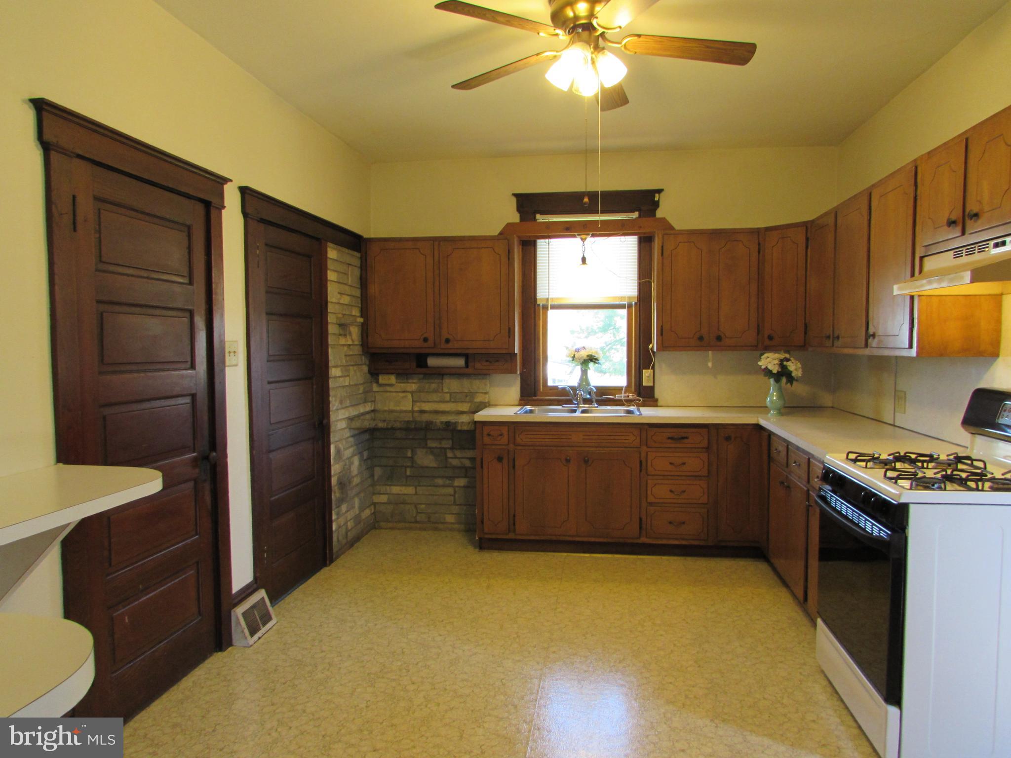 33 North Kinzer Road Kinzers, PA 17535 - Photo 8 of 15 a kitchen with cabinets a window and stainless steel appliances