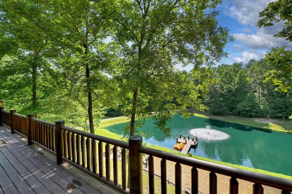 505 Old Salem Road Mineral Bluff, GA 30559 - Photo 24 of 88 a view of a wooden deck and a yard with wooden fence