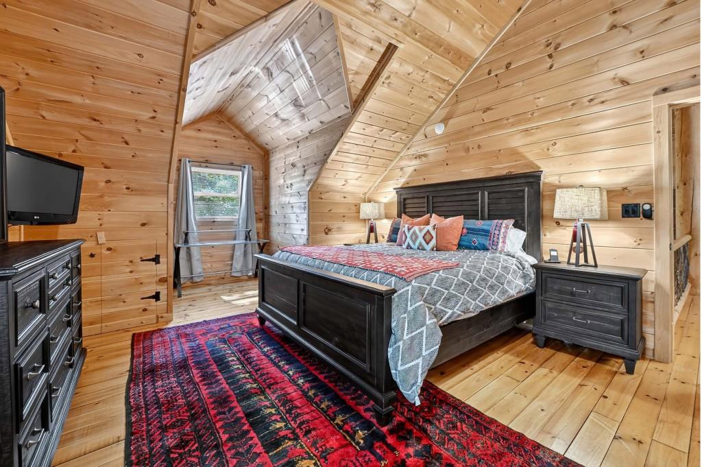 505 Old Salem Road Mineral Bluff, GA 30559 - Photo 31 of 88 a bed room with a bed and a flat tv screen