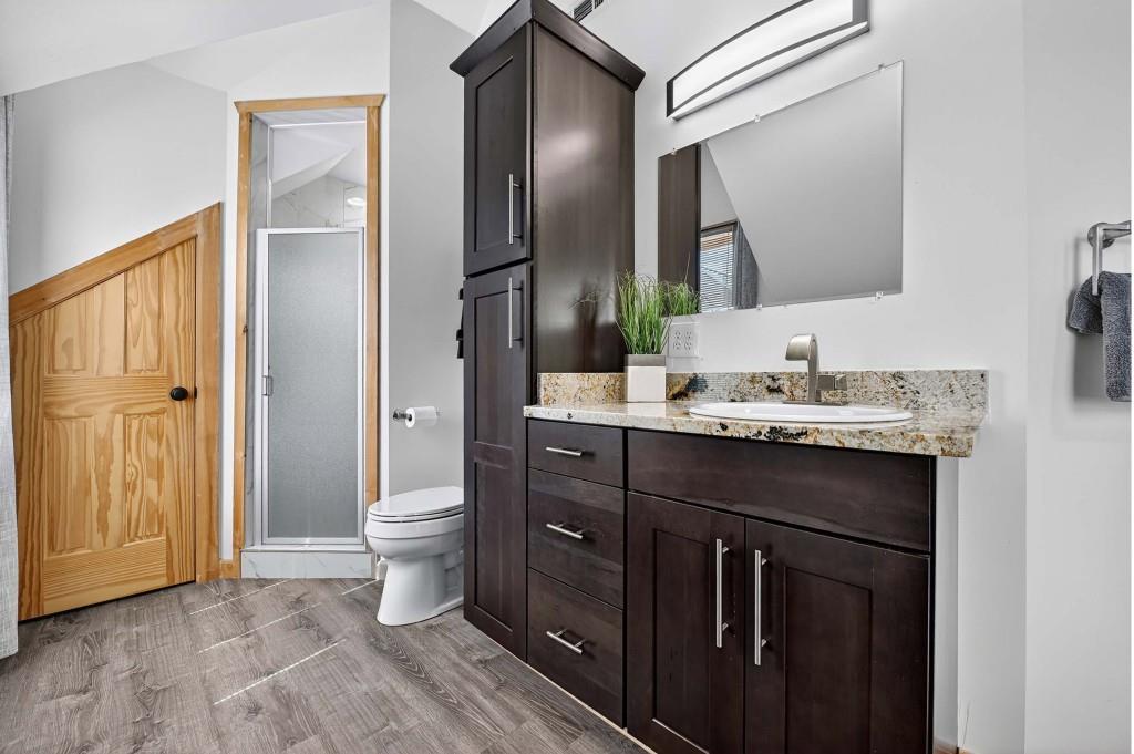 505 Old Salem Road Mineral Bluff, GA 30559 - Photo 66 of 88 a bathroom with a double vanity sink toilet and a mirror