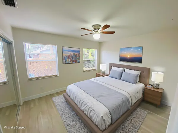 a bedroom with a large bed and a window