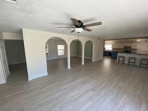 a view of a livingroom with furniture and wooden floor
