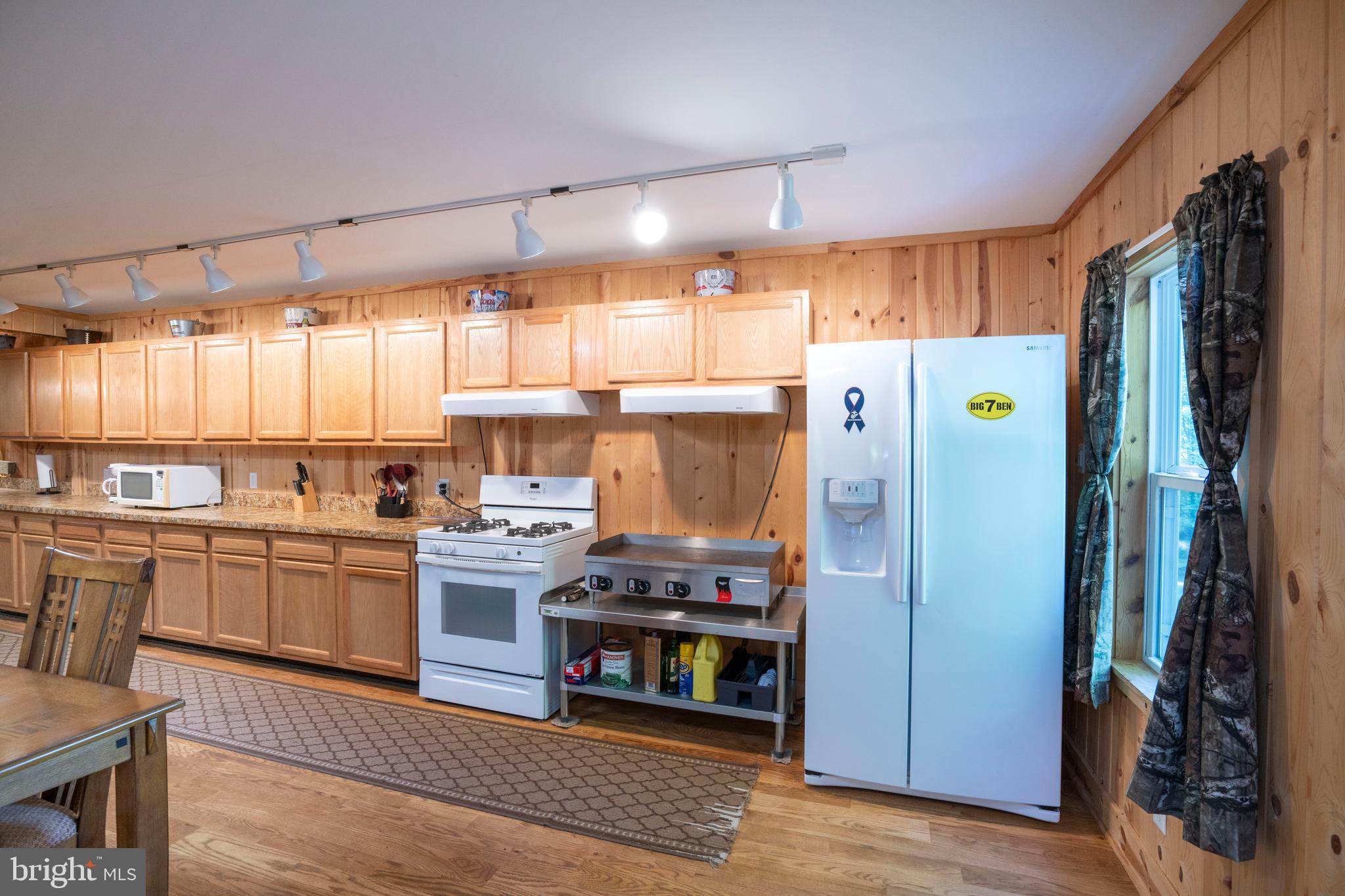 385 Elk Creek Road Aaronsburg, PA 16820 - Photo 28 of 71 a kitchen with stainless steel appliances granite countertop a refrigerator and a stove top oven