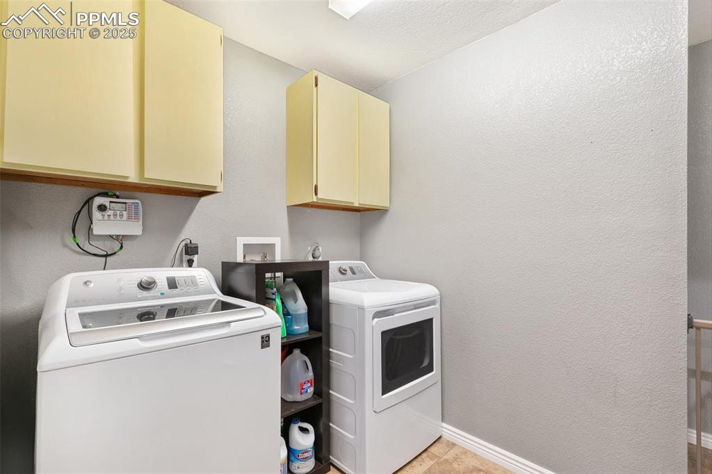 89 Security Boulevard Colorado Springs, CO 80911 - Photo 12 of 29 a utility room with dryer and washer