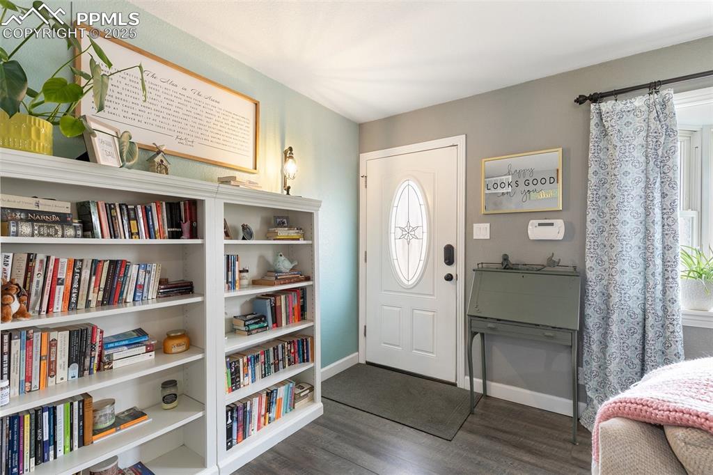 89 Security Boulevard Colorado Springs, CO 80911 - Photo 2 of 29 a view of room with window and wooden floor