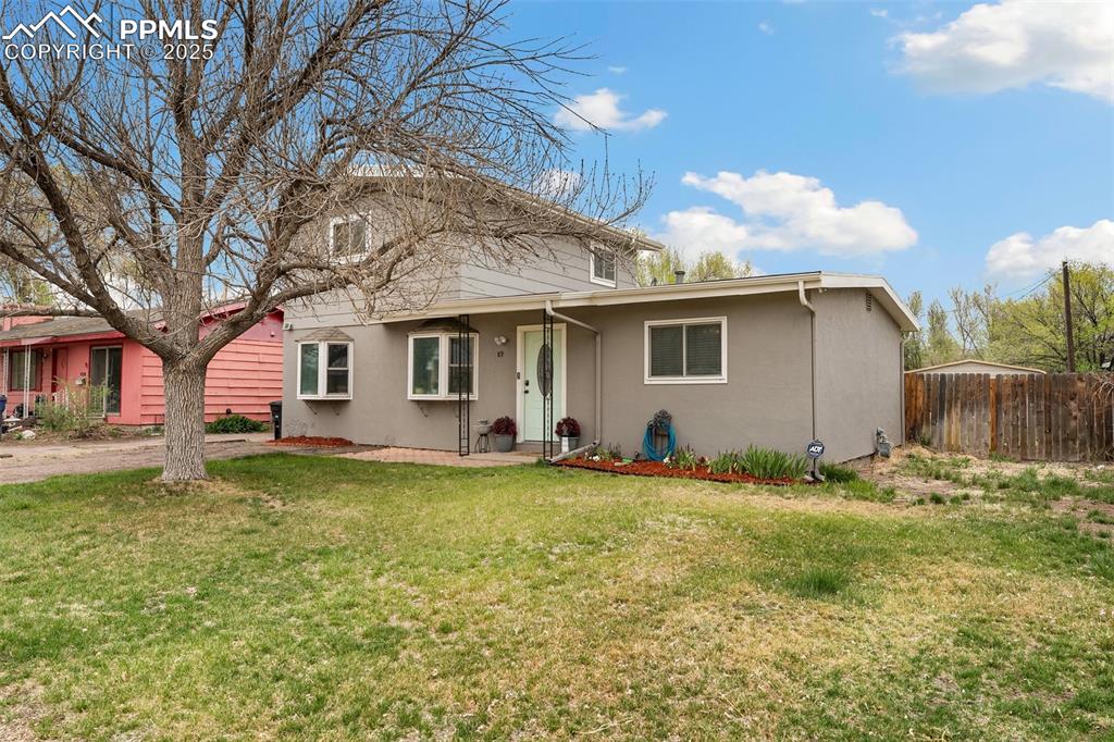 89 Security Boulevard Colorado Springs, CO 80911 - Photo 27 of 29 a backyard of a house with table and chairs