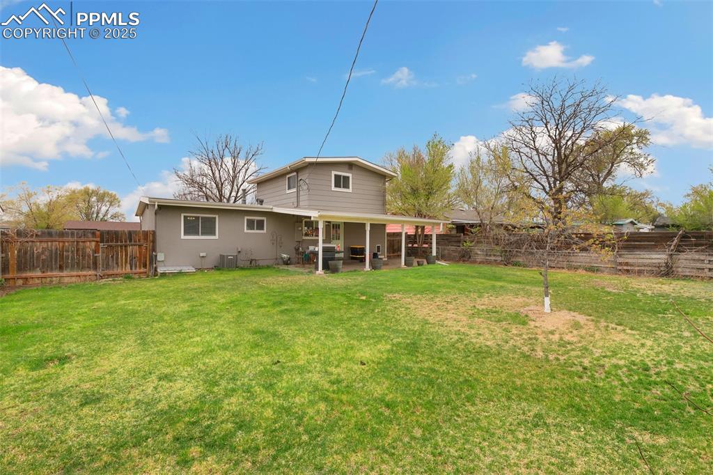 89 Security Boulevard Colorado Springs, CO 80911 - Photo 29 of 29 a front view of a house with a yard table and chairs