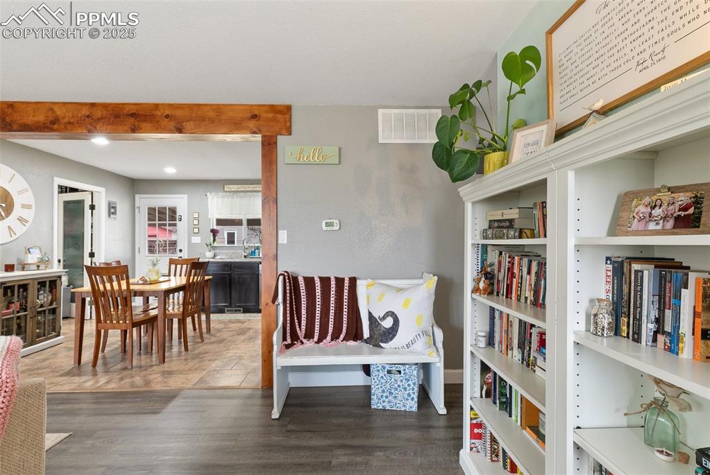 89 Security Boulevard Colorado Springs, CO 80911 - Photo 3 of 29 a living room with furniture and a book shelf