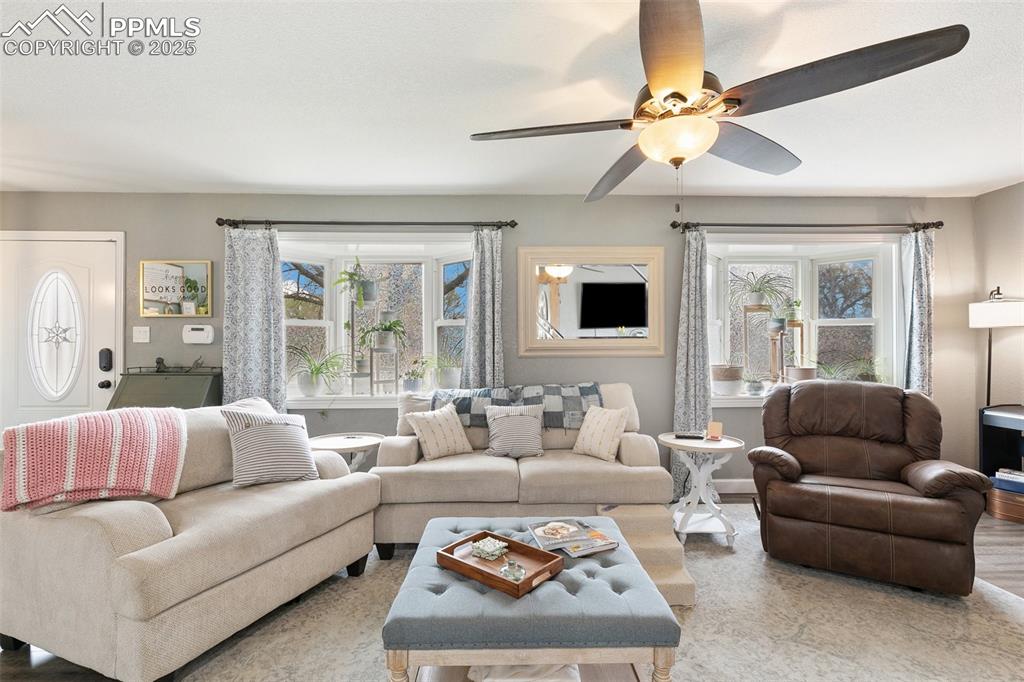 89 Security Boulevard Colorado Springs, CO 80911 - Photo 5 of 29 a living room with furniture and a large window