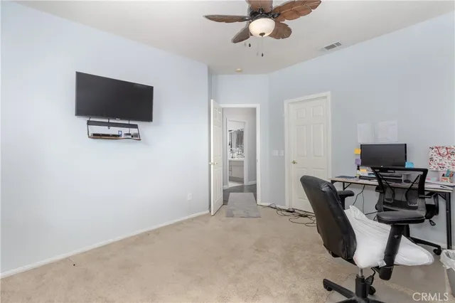 a view of a workspace with furniture