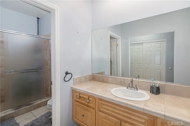 a bedroom with a bed and a table