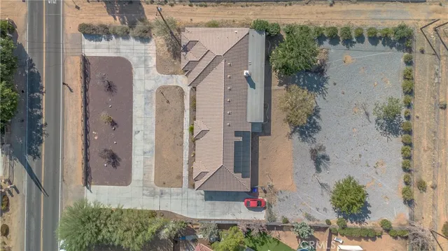 a front view of a house with a yard and fountain