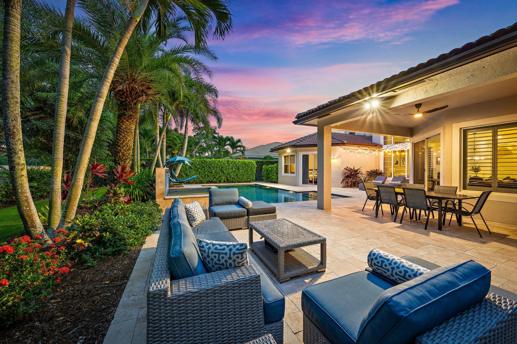 283 Rudder Cay Way Jupiter, FL 33458 - Photo 4 of 41 a view of a patio with couches and a fire pit