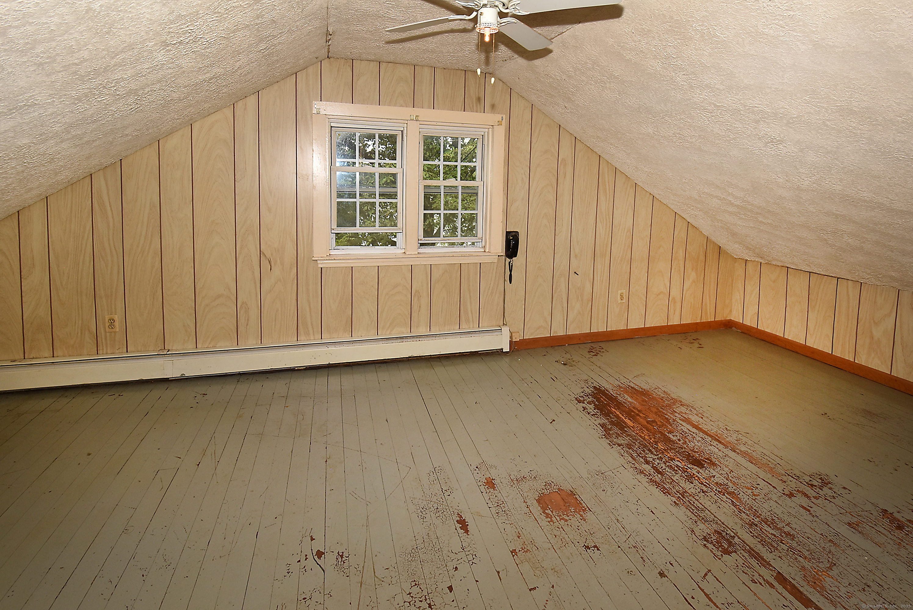 Undisclosed Address Vernon, CT 06066 - Photo 14 of 34 a view of a livingroom with wooden floor and staircase