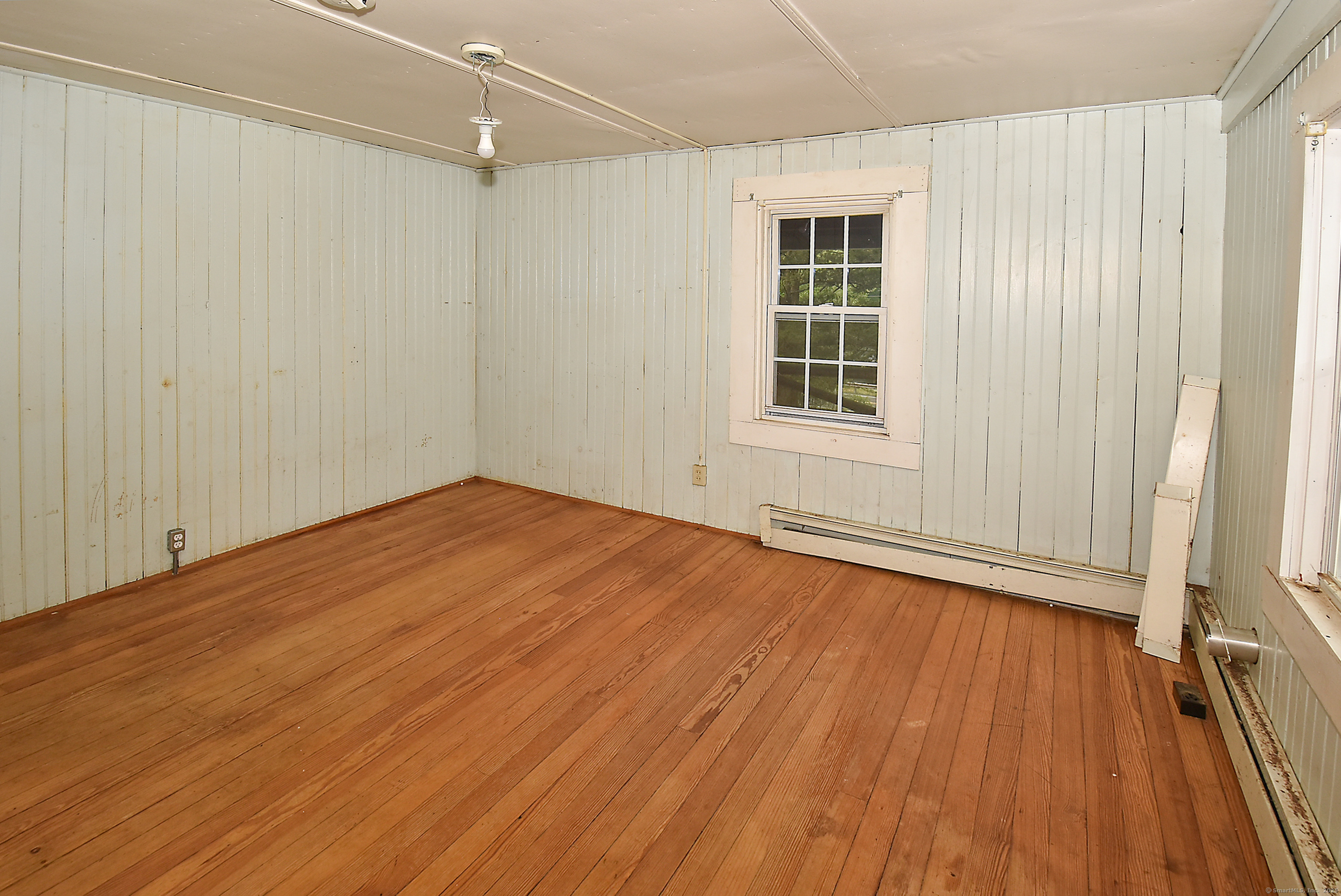 Undisclosed Address Vernon, CT 06066 - Photo 20 of 34 an empty room with wooden floor and windows