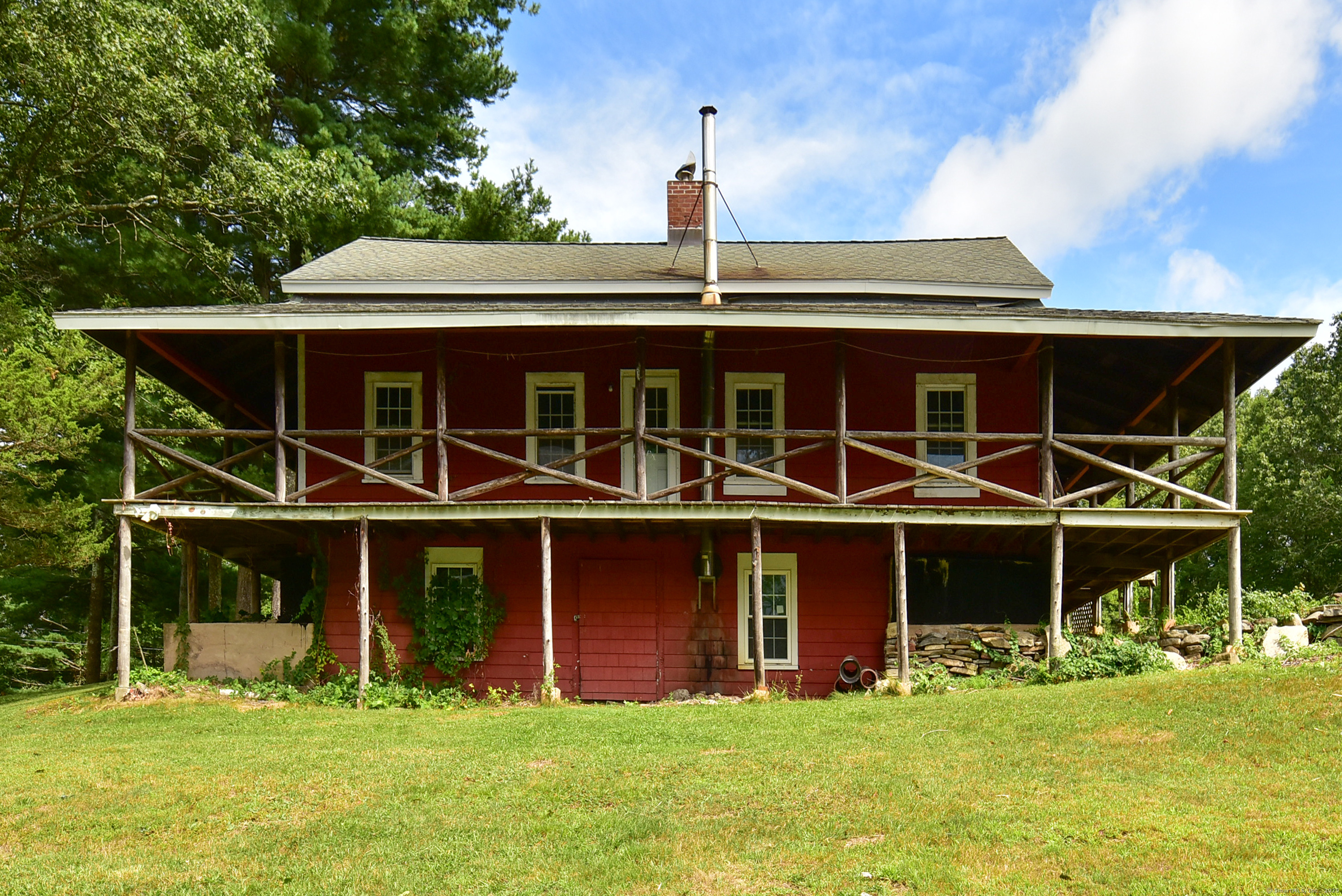 Undisclosed Address Vernon, CT 06066 - Photo 30 of 34 a front view of a house with a yard table and chairs
