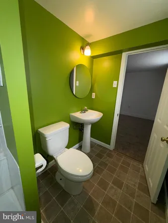 a bathroom with a bathtub a sink and a shower
