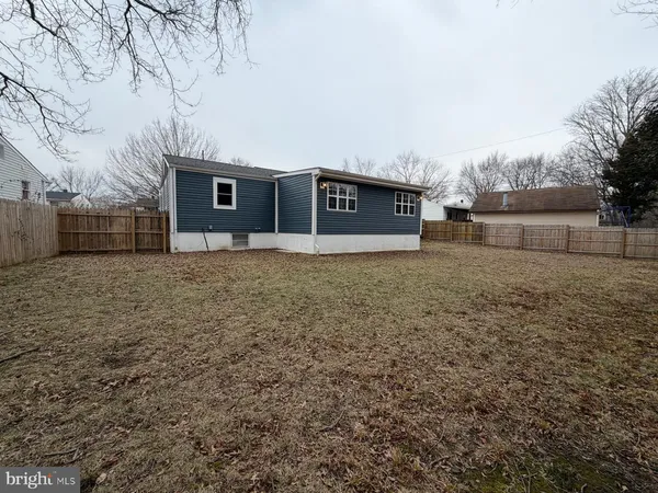 a house that has a tree in front of it