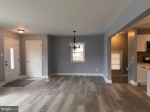 a view of livingroom with hardwood floor and a ceiling fan
